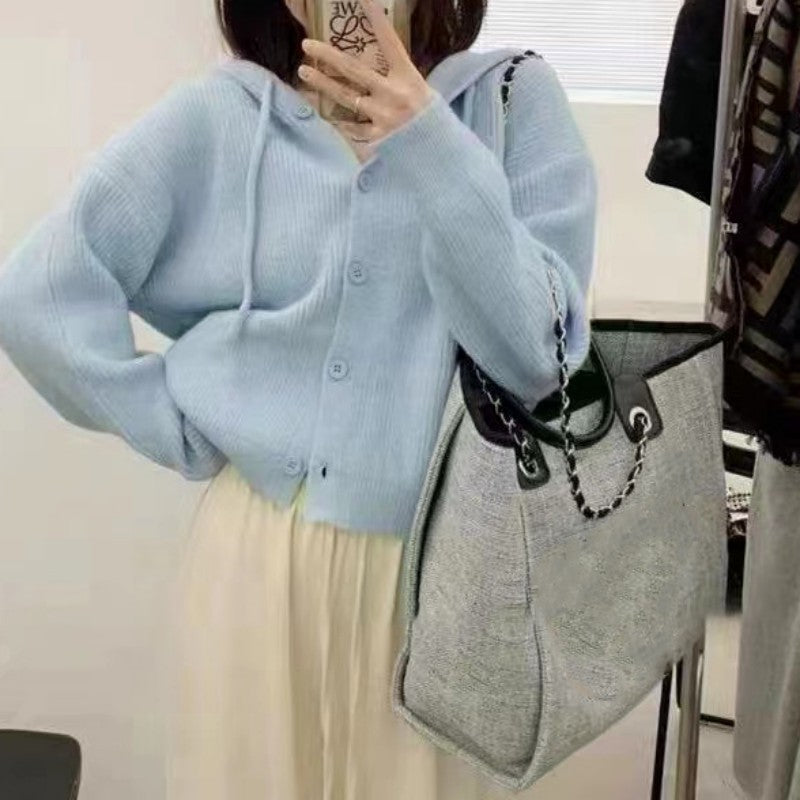 Oversized hooded knit sweater in light blue - women's cozy cardigan style