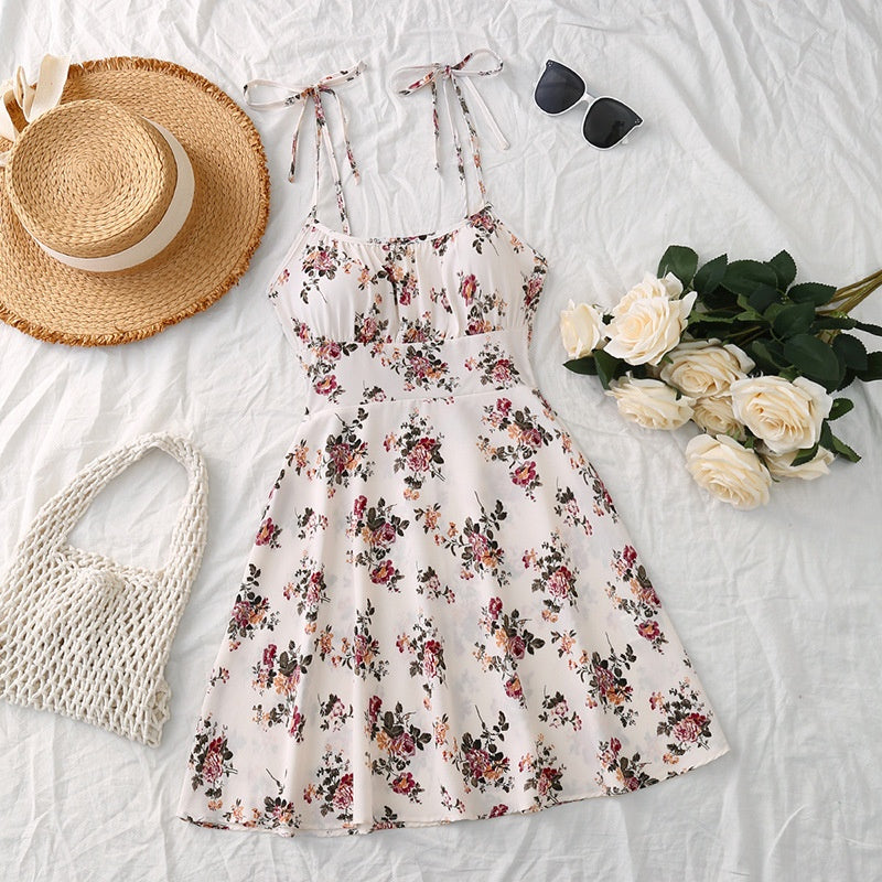  Floral A-line summer dress styled flat lay with straw hat and sunglasses - AuraAttire