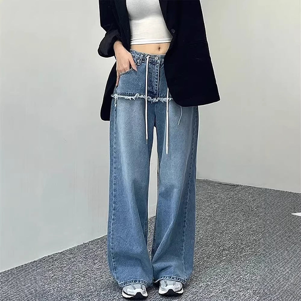 Women's wide-leg denim-look jeans in light blue, drawstring waist, raw hem, full length front view