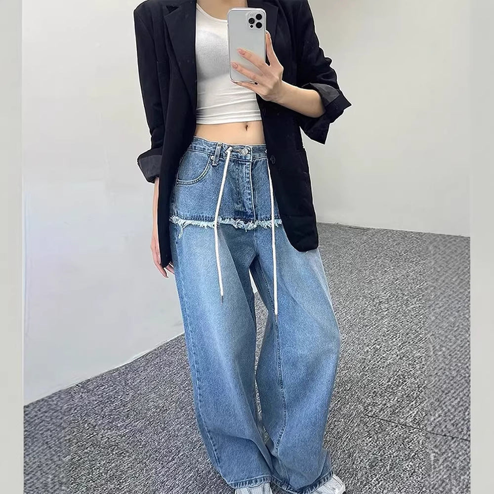 Women's wide-leg denim-look jeans in light blue, drawstring waist, styled with black blazer, mirror selfie outfit