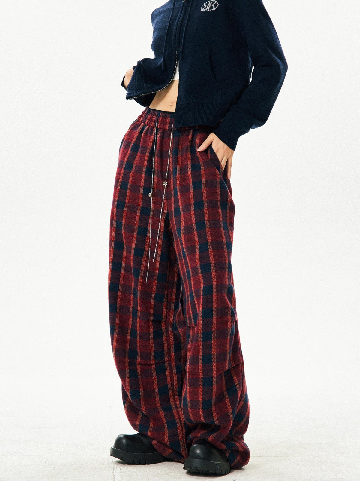 Women's retro high-waisted red plaid wide-leg pants, side view with chain detail