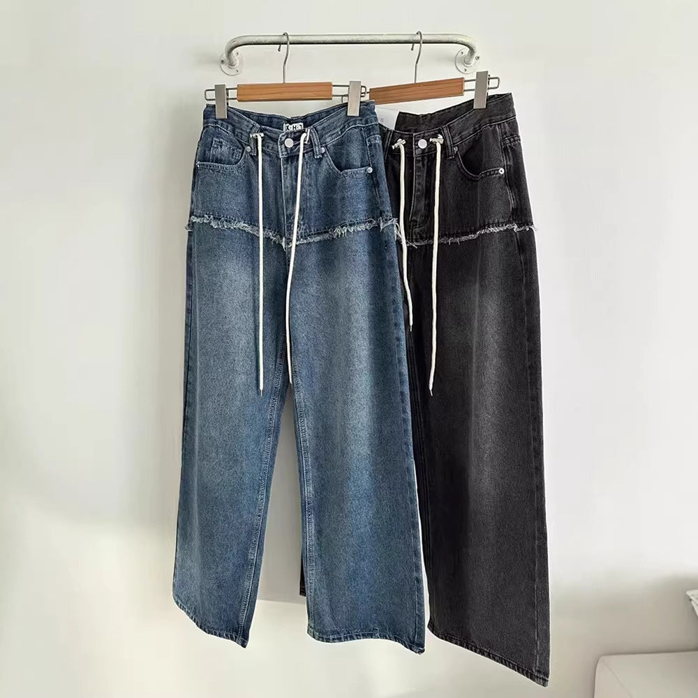 Wide-leg denim-look jeans on hanger, blue and black colorways, drawstring waist