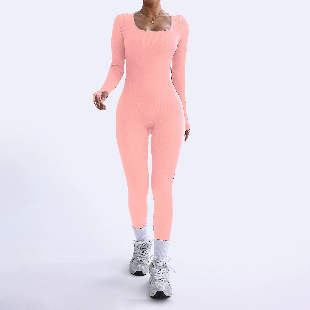 Person wearing a pink bodysuit on a white background