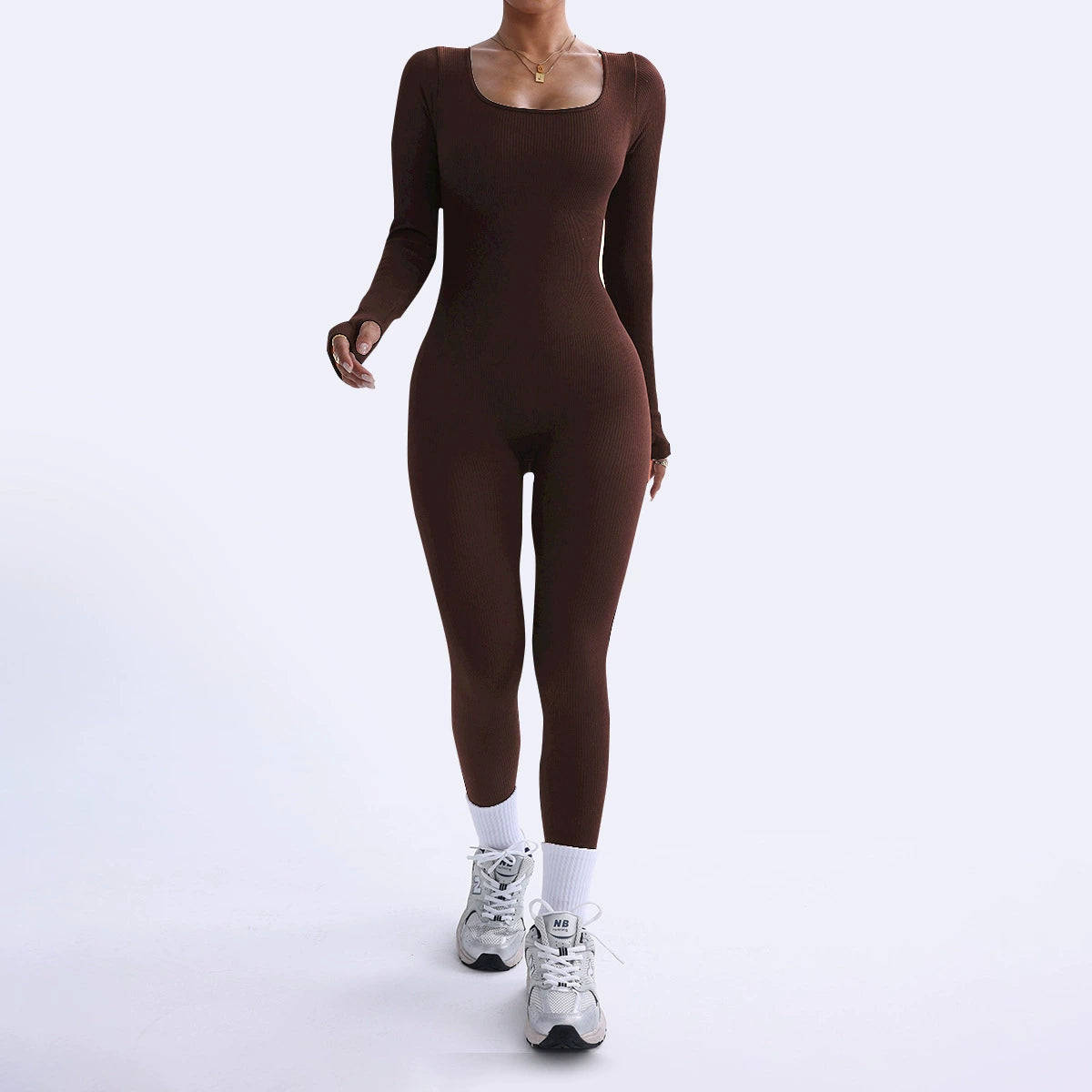 Person wearing a brown bodysuit on a white background