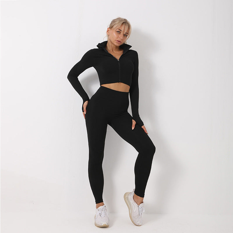 Woman wearing a black athletic outfit on a white background