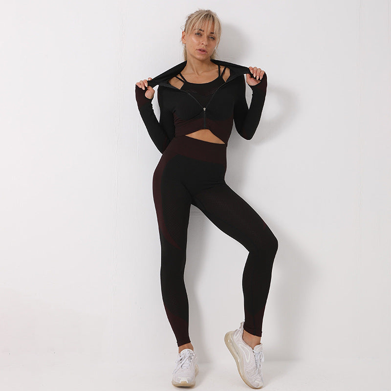 Woman wearing a black athletic outfit on a white background