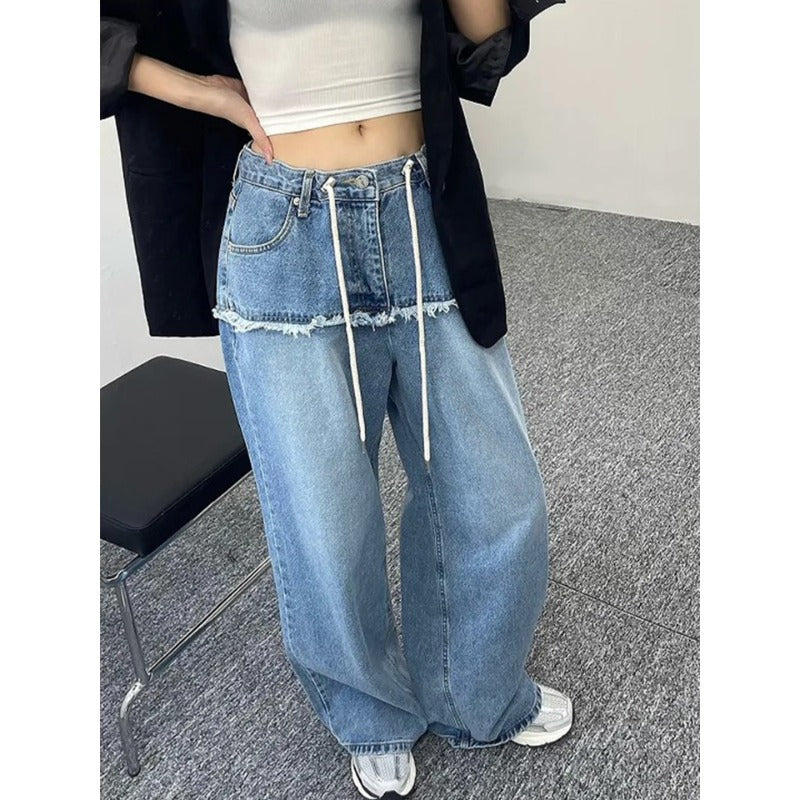Women's wide-leg denim-look jeans in light blue, drawstring waist, raw hem, close-up front view