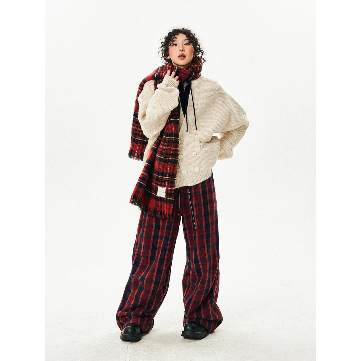 Women's retro high-waisted red plaid wide-leg pants, styled with white sweater and matching scarf