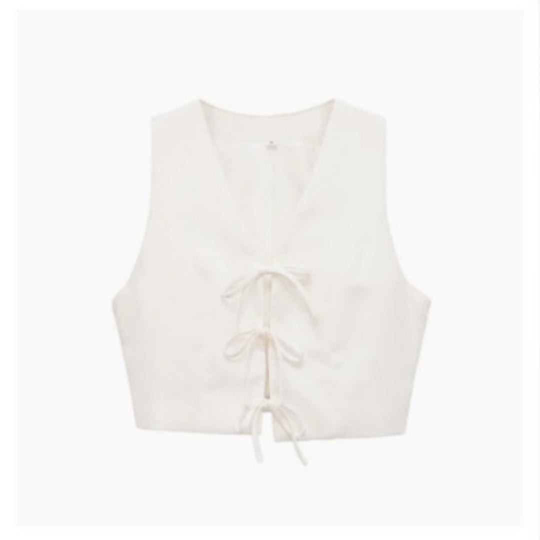 White bow-tie lace-up vest with drawstring waist - flat lay view