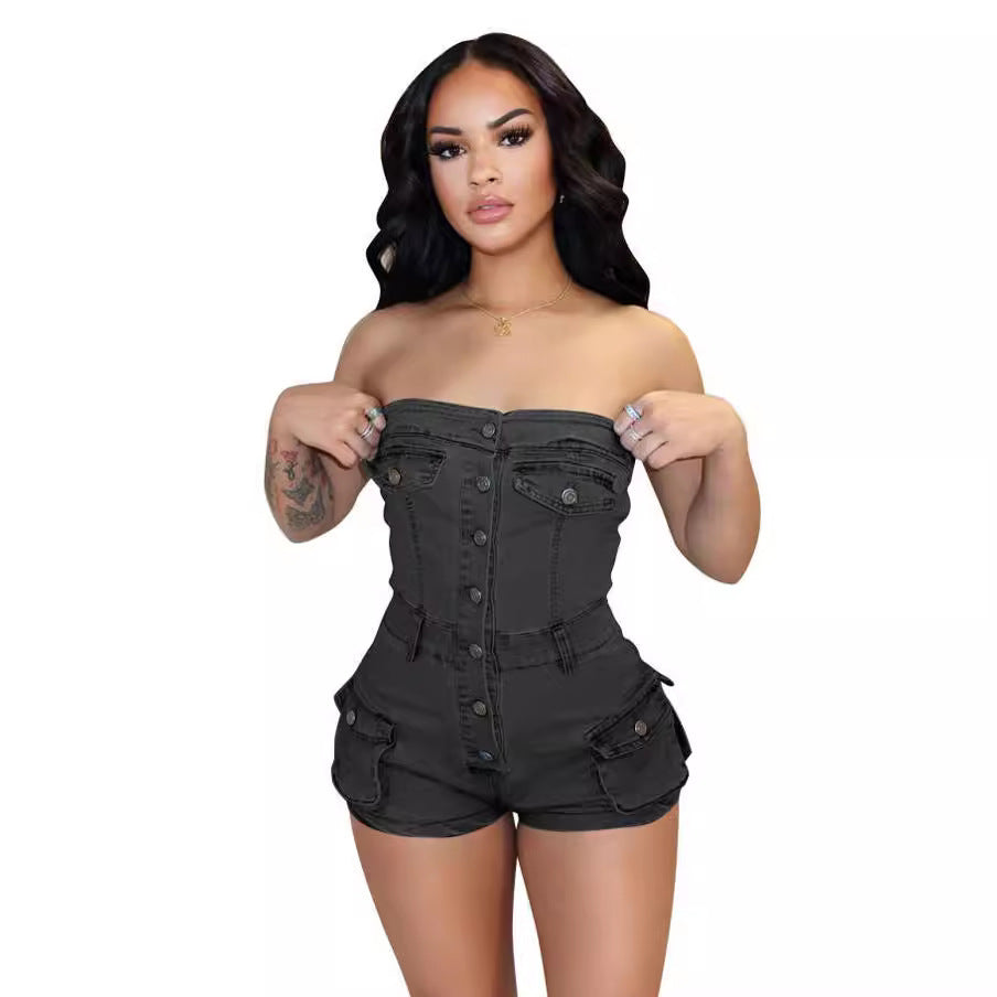 Woman wearing a black strapless romper on a white background